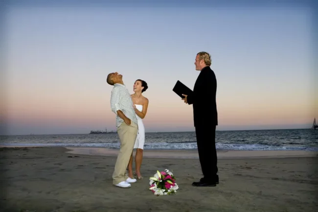 The officiant guy is the best beach wedding celebrant in LA. He's a very experience marriage minister in Southern California.